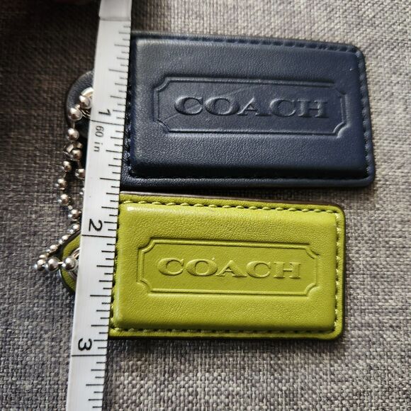 This bag is making me think summer is here already  Coach Lime And Navy Leather Bag Charms